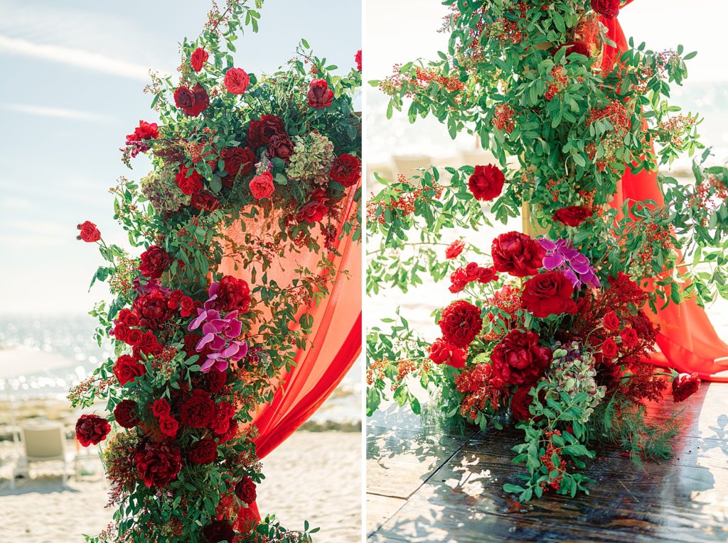 Detail shot of red flowers on wedding arch