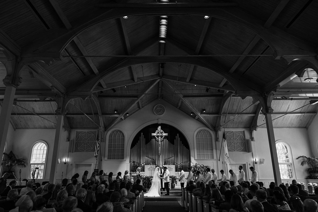Wide shot of Bride and Groom during the ceremony B&W