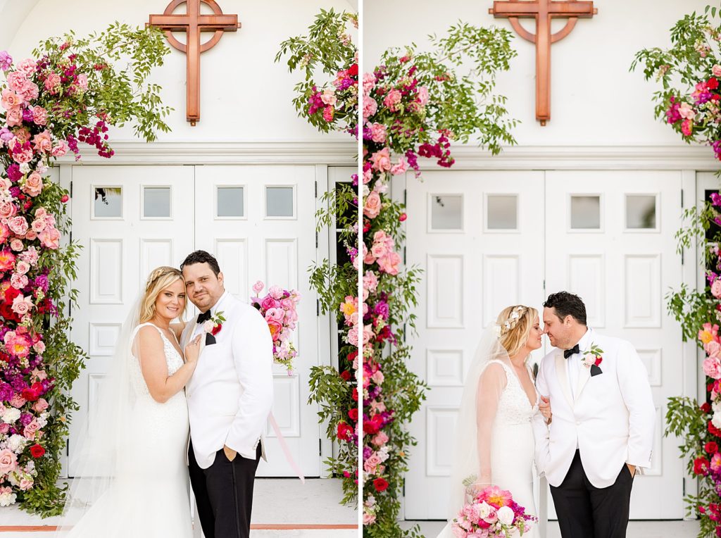 Bride and Groom holding each other with pink flowers behind them