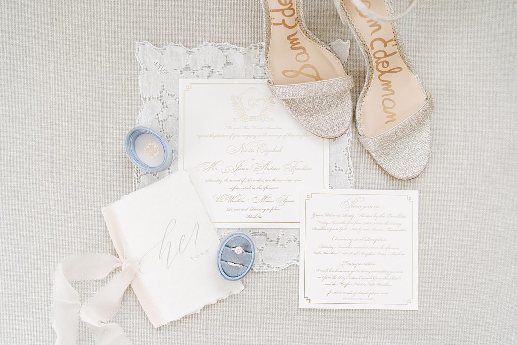 Detail shot of Sam Edelman heels and wedding bands invitations and engagement ring
