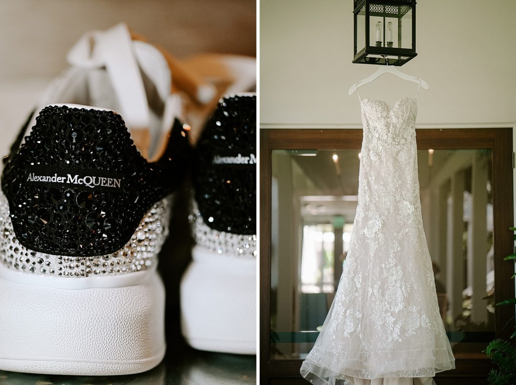 Detail shot of glitter personalized wedding shoes and wedding dress hanging