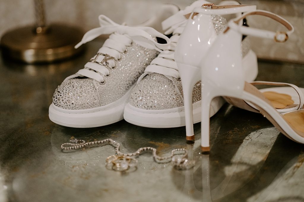 Detail shot of glitter shoes and heels with jewelry